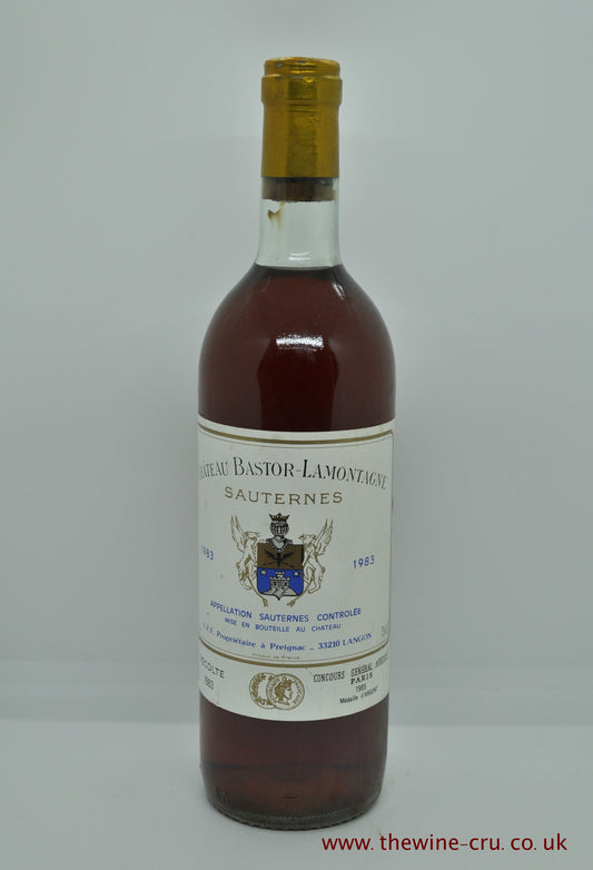 1983 vintage sweet white wine. Chateau Bastor Lamontage, Bordeaux, France. The bottle is in general good condition with the wine level being base of neck. Immediate delivery. Free local delivery. gift wrapping available.
