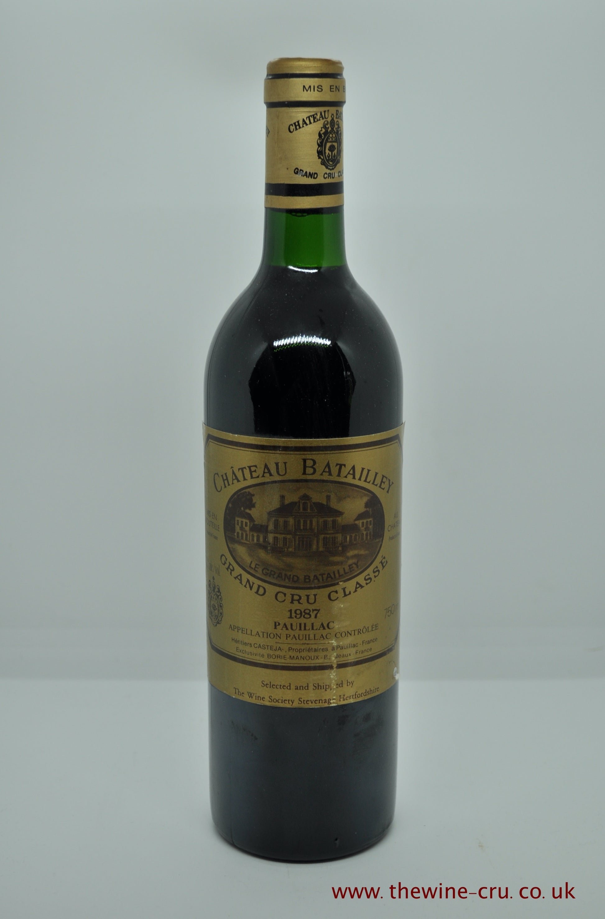 A bottle of 1987 vintage red wine from Chateau Batailley, Bordeaux, France. The bottle is in good condition with the fill level at the base of the neck. Immediate delivery. Free local delivery. Gift wrapping available.