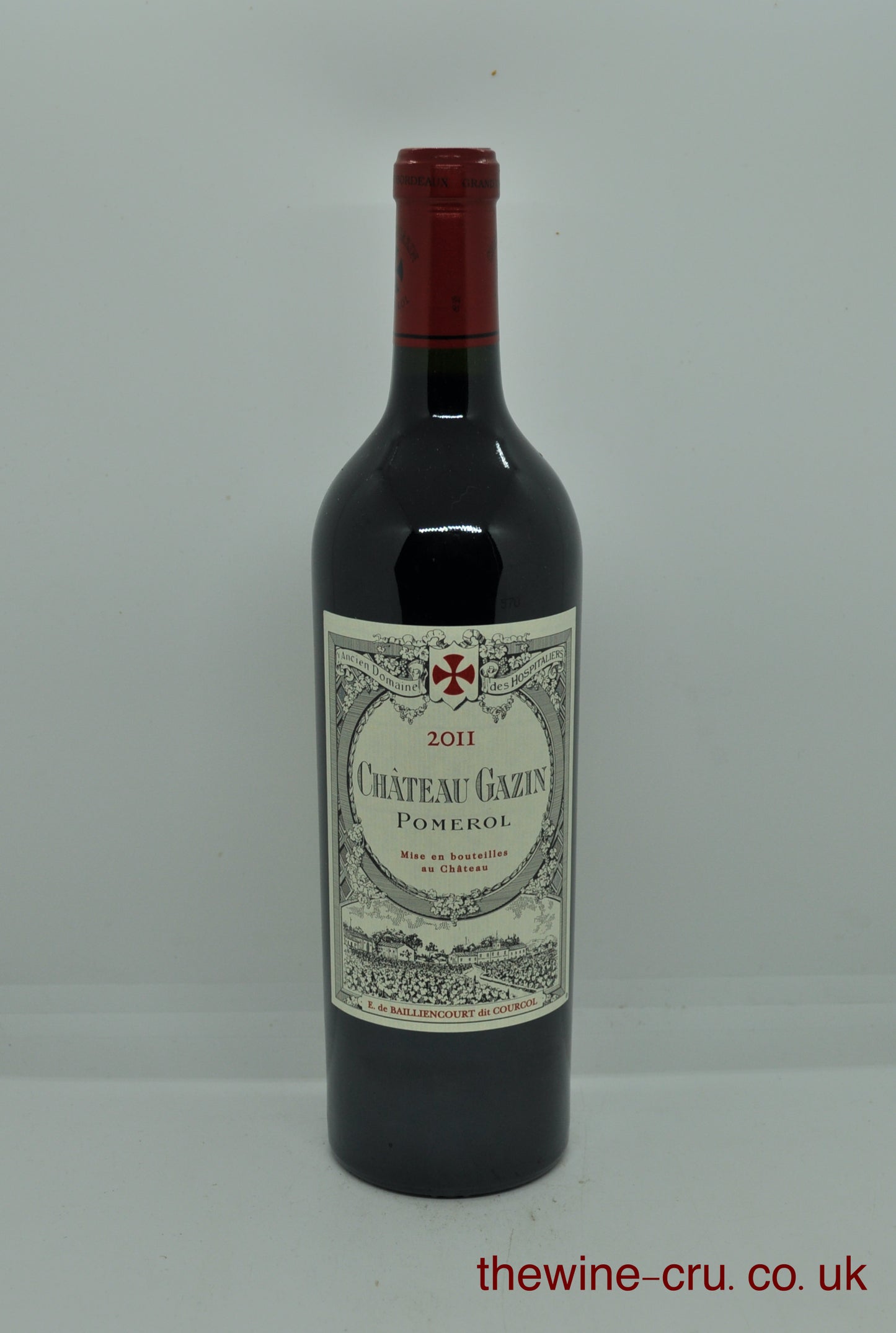 Bottle of Chateau Gazin Pomerol wine on a white background. 2011 vintage red wine. The bottle is in good condition. Immediate delivery. Free local delivery. Gift wrapping available.