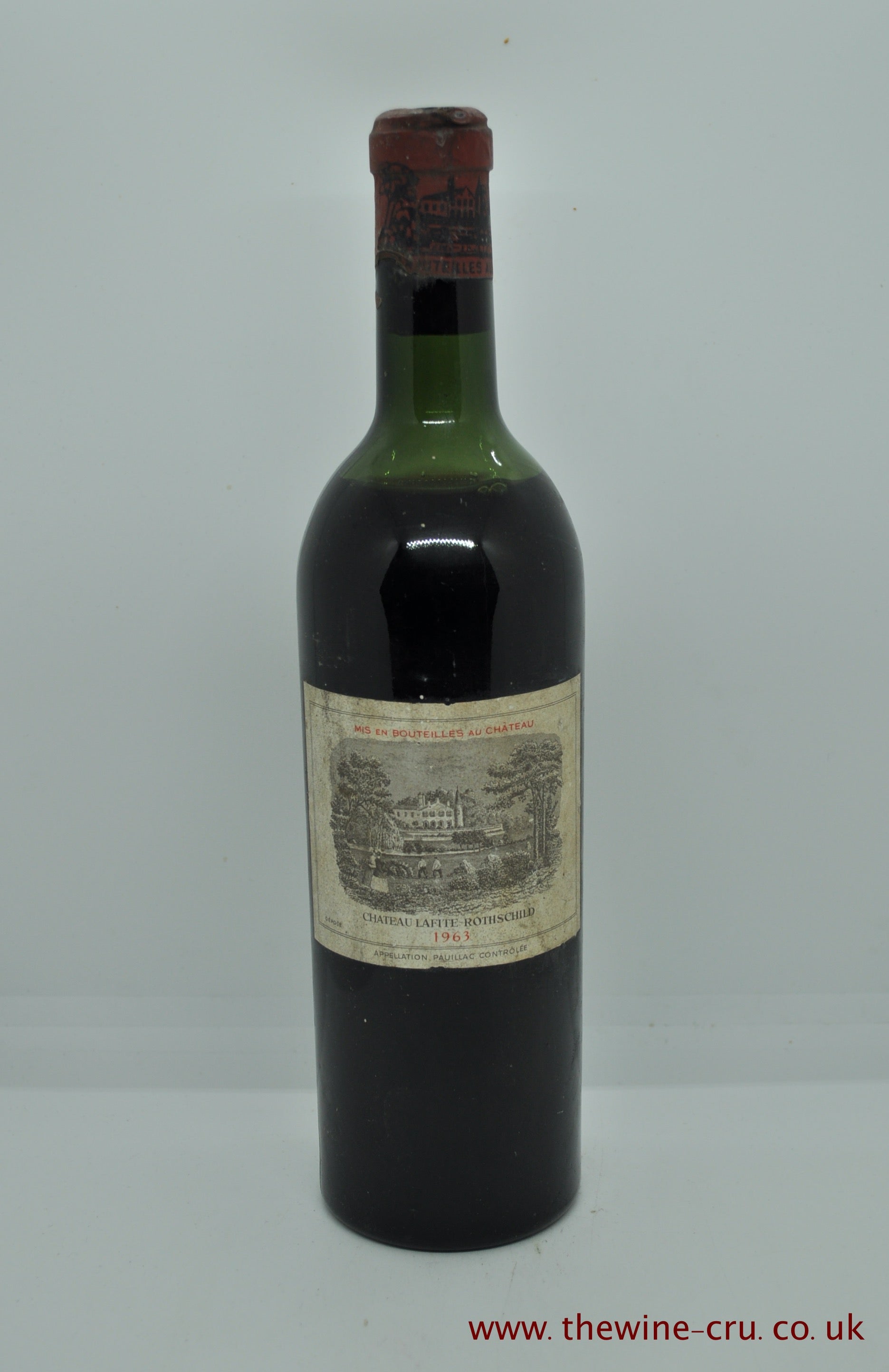 1963 vintage red wine. Label is bin soiled and the wine level is high shoulder. Immediate delivery. Free local delivery. Gift wrapping available.