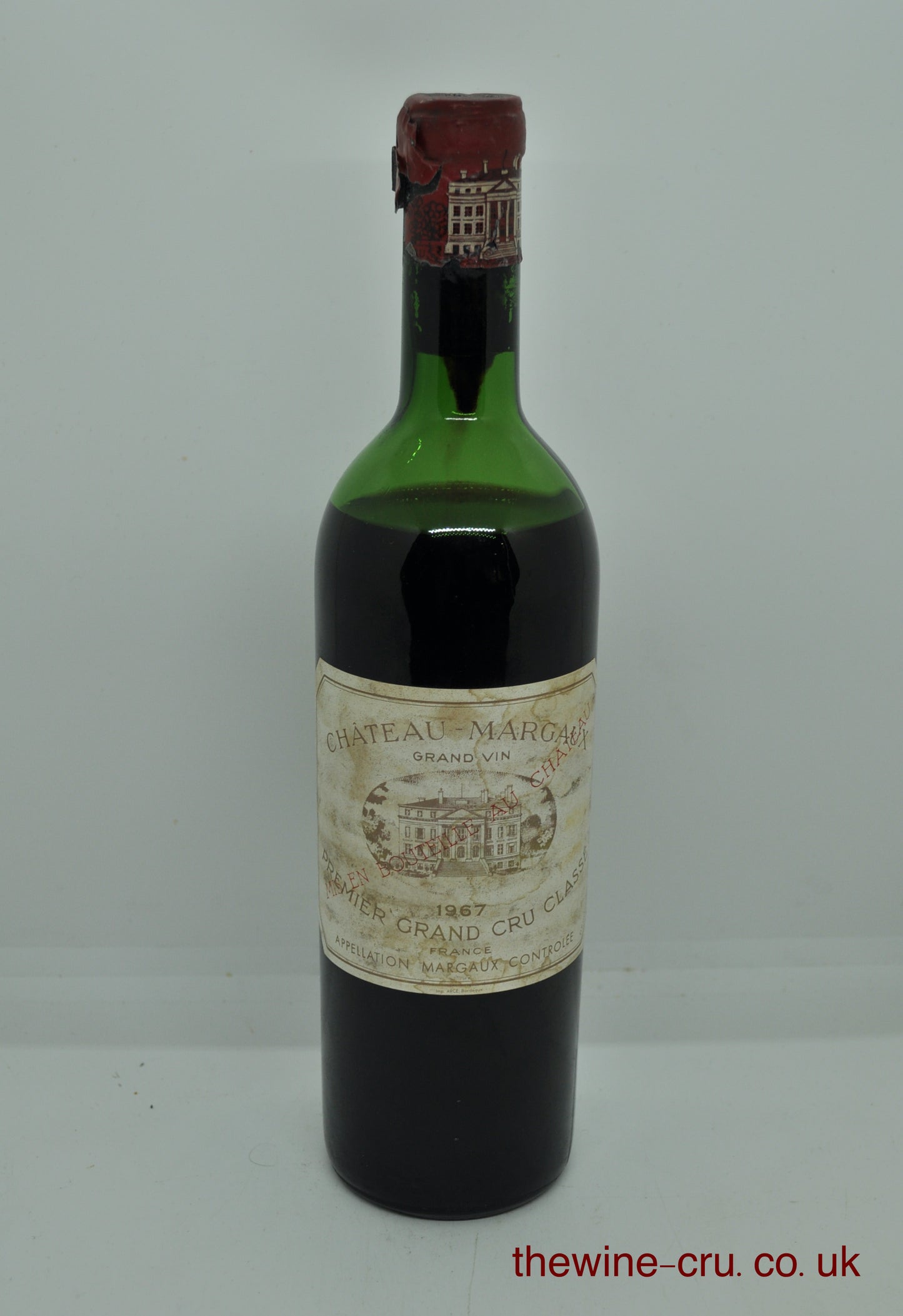 1967 vintage red wine. The capsule has some damage, but the top is sound. Label bin soiled and the wine level is low shoulder. Immediate delivery. Free local delivery. Gift wrapping available.