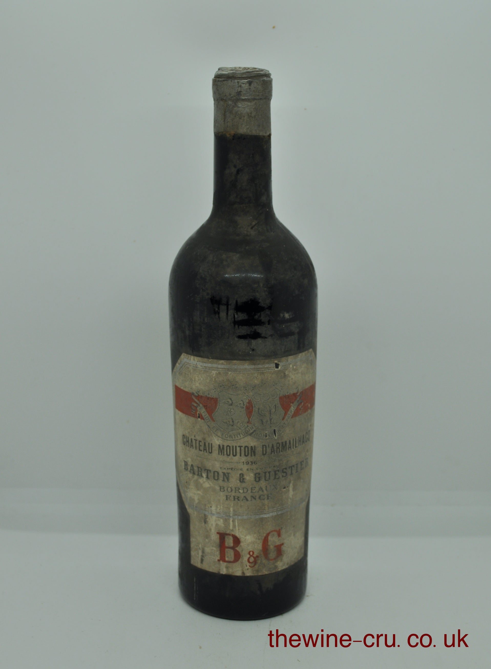 1936 vintage red wine. The bottle is dirt and the wine level is mid shoulder. Immediate delivery. Free local delivery. Gift wrapping available.