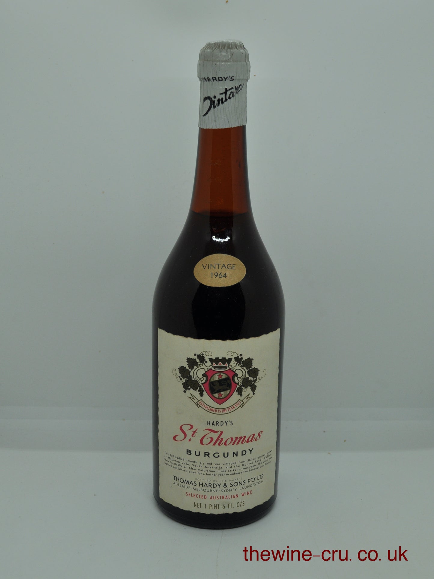 1964 vintage red wine from Australia. An imperial pint bottle The cork is slightly raised and the wine level is 3cm below base of the cork. Immediate delivery. free local delivery. Gift wrapping available.