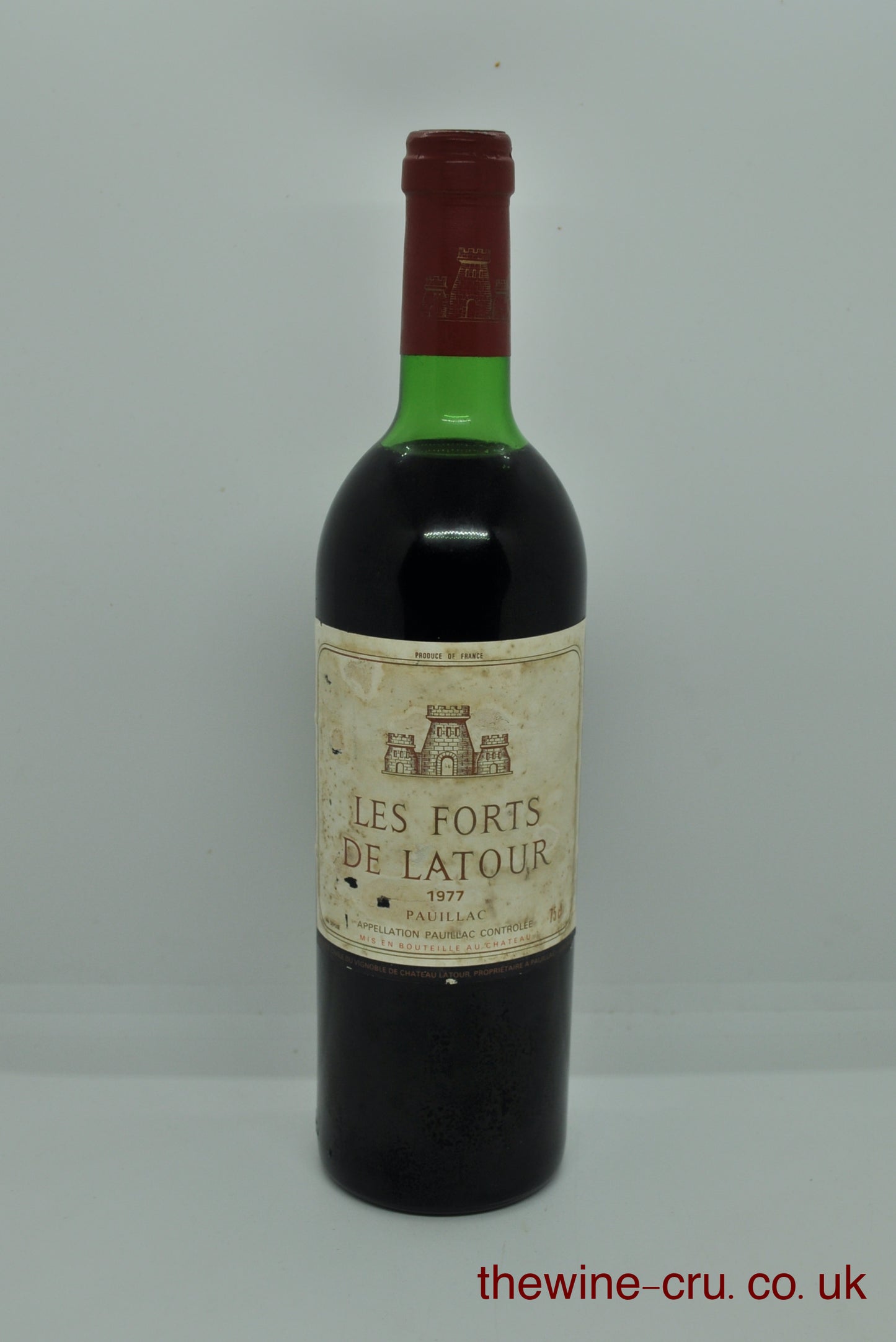 1977 vintage red wine for Pauillac, Bordeaux. The bottle is in good general condition. The label is a little bin soiled and the wine level is top shoulder. Immediate delivery. Free local delivery. Gift rapping available