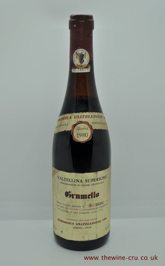 1980 vintage red wine. Enoloica Valtellinese Grumelo 1980. Italy Lombardy. The bottle is in good general condition with the wine level being 3cm blow base of cork. Immediate delivery. Free local delivery.  Gift wrapping available
