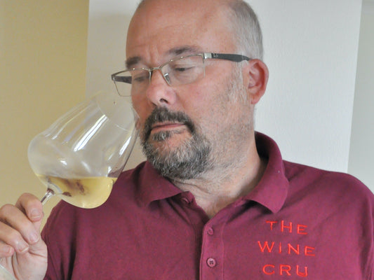 Jonathan owner of The Wine Cru enjoying a glass of vintage wine