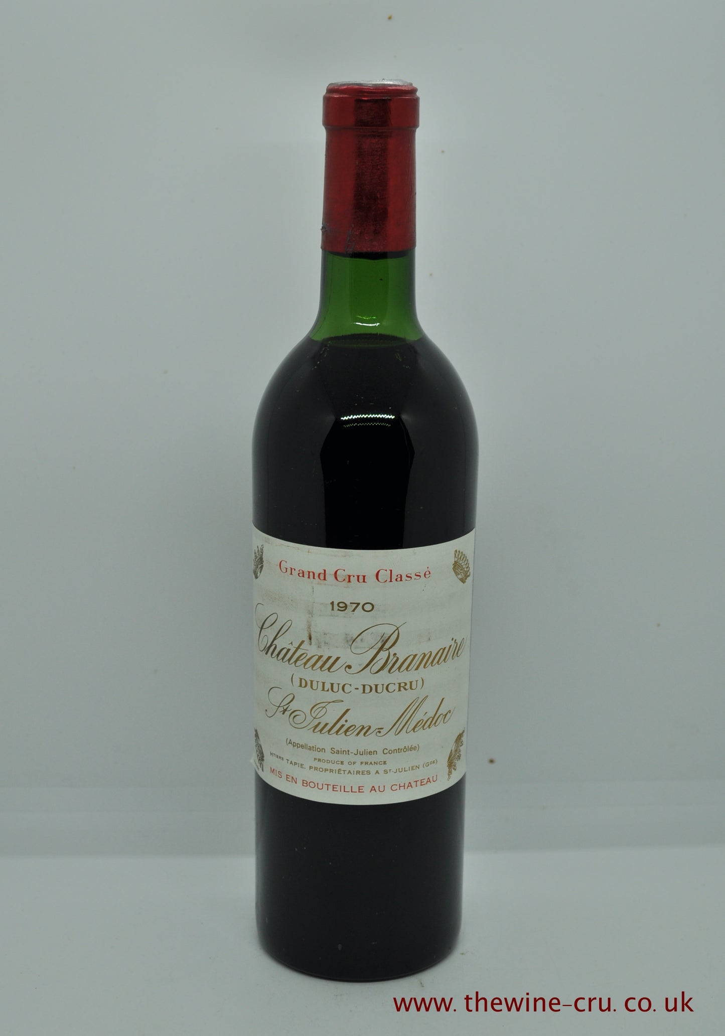 1970 vintage red wine from Bordeaux, France. The capsule has a small ct on one side and the wine level is very top shoulder. Immediate delivery. Free local delivery. Gift wrapping available.