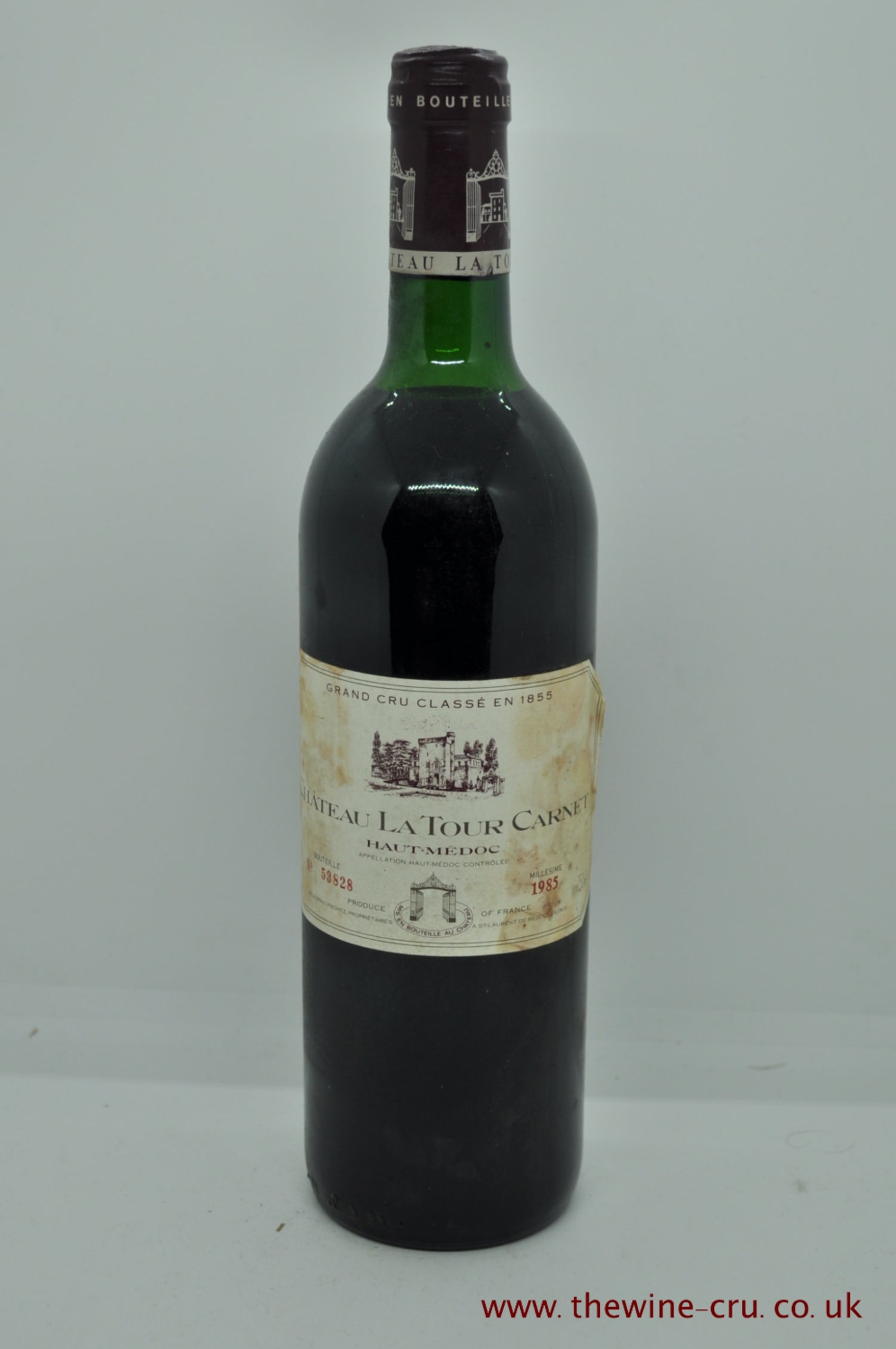 1985 vintage red wine. Chateau La Tour Carnet 1985, Bordeaux France. The bottle is in good condition, the label is a little bin soiled and the wine level is top shoulder. Immediate delivery. Free local delivery. Gift wrapping available.