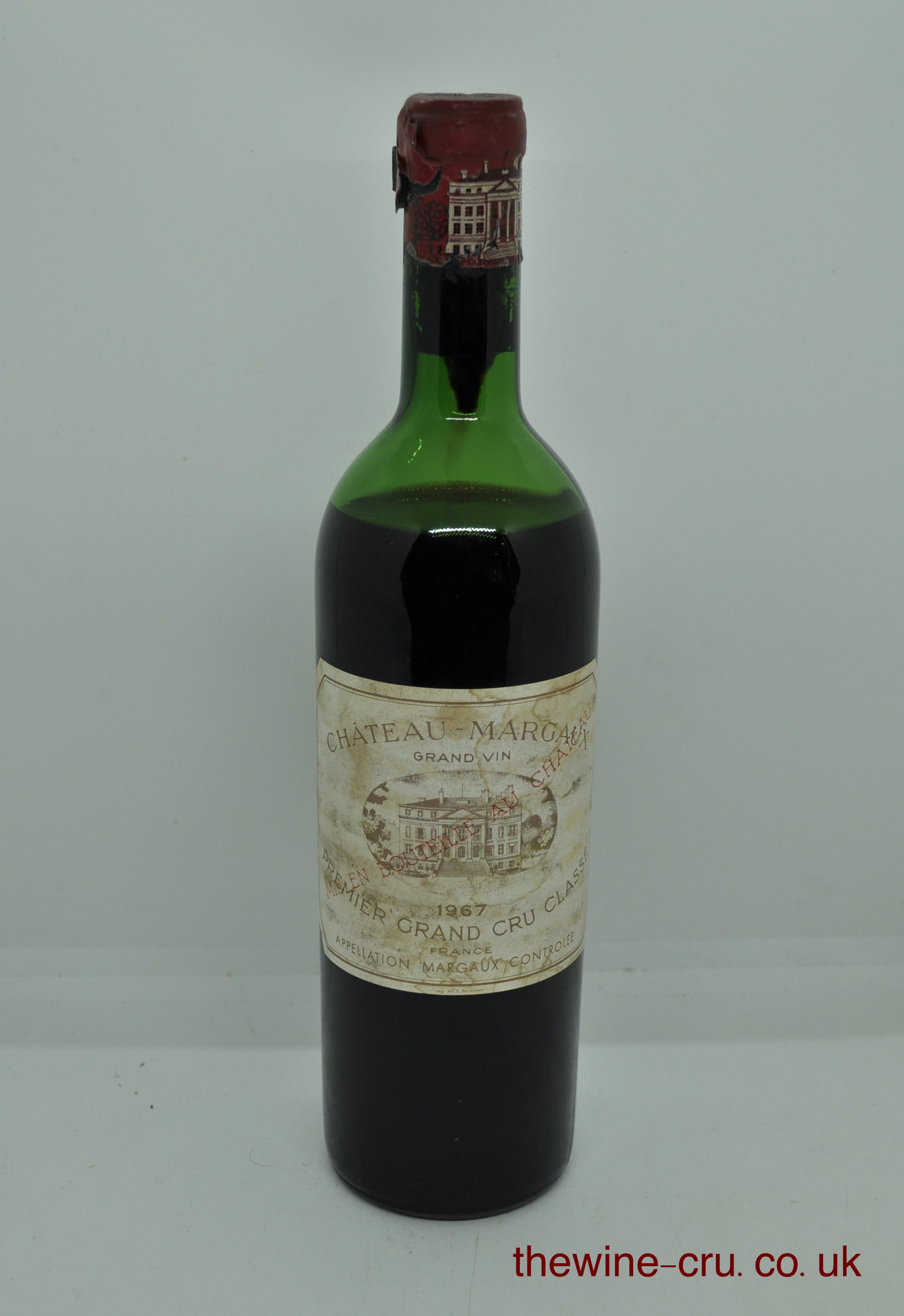 1967 vintage red wine. The capsule has some damage, but the top is sound. Label bin soiled and the wine level is low shoulder. Immediate delivery. Free local delivery. Gift wrapping available.