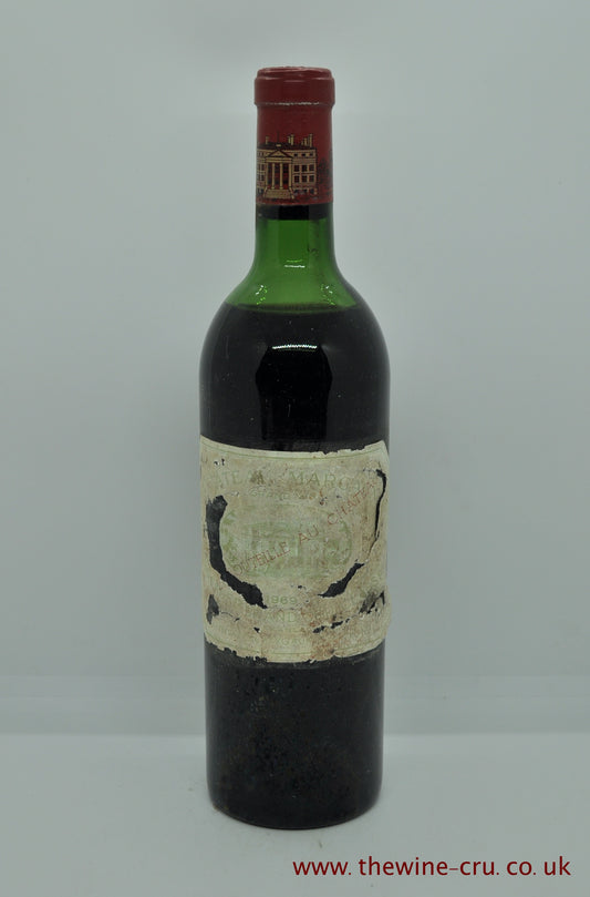 1969 vintage red wine. Chateau Margaux, France, Bordeaux. The level is high shoulder. The label is bin soiled but vintage and chateau are legible. Immediate delivery. Free local delivery. Gift wrapping available