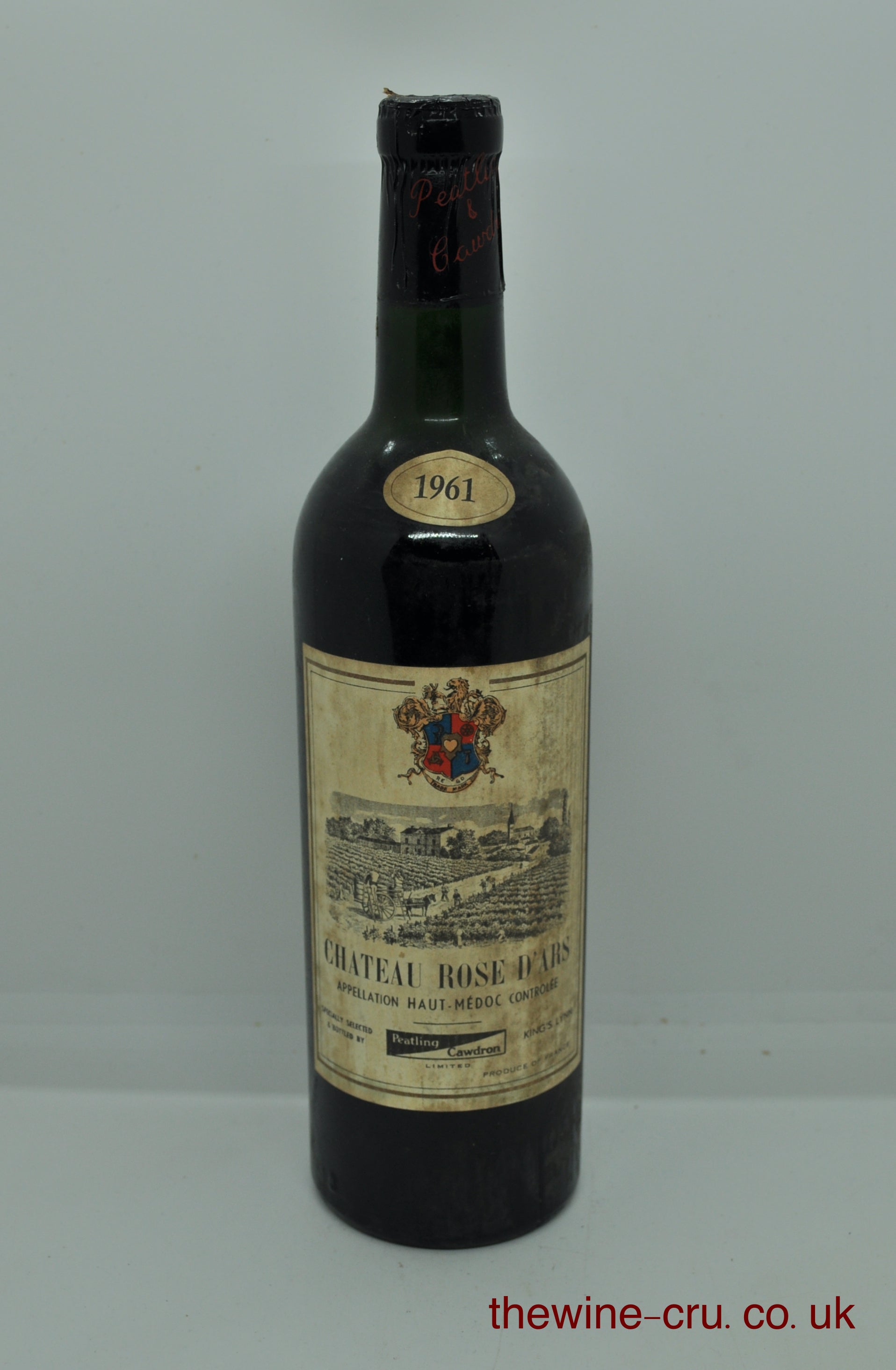 1961 vintage red wine. An English bottling by Peatling & Cawdron, King's Lynn. The bottle is in good general condition. A little damage to the capsule and the wine level is top shoulder. Immediate delivery. Free local delivery. Gift wrapping available.