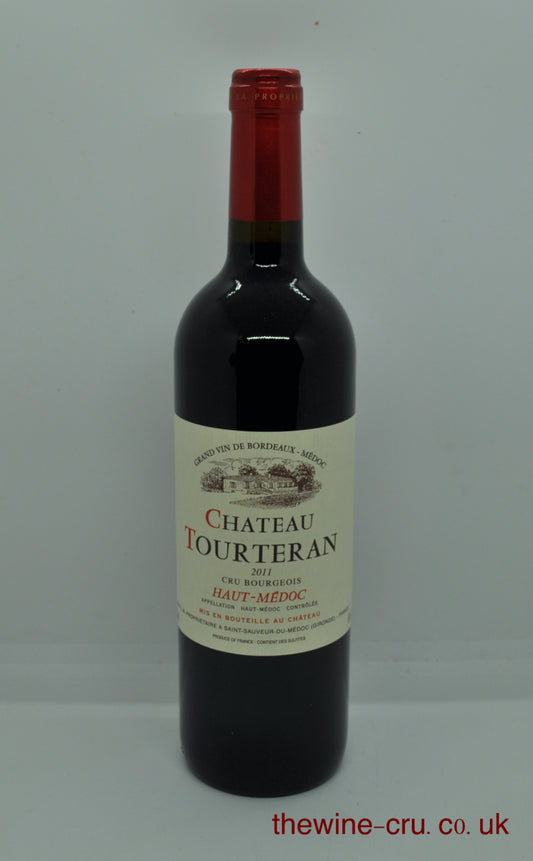 Bottle of Chateau Tourteran wine on a white background. A 2011 vintage red wine from Bordeaux. The bottle is in excellent condition. Immediate delivery. Free local delivery. Gift wrapping available.