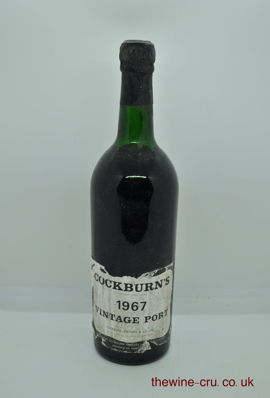 1967 vintage port wine. The bottle is in good condition for its age. The label is a little bin soiled and the wine level is top shoulder. Immediate delivery. Free local delivery. Gift wrapping available.