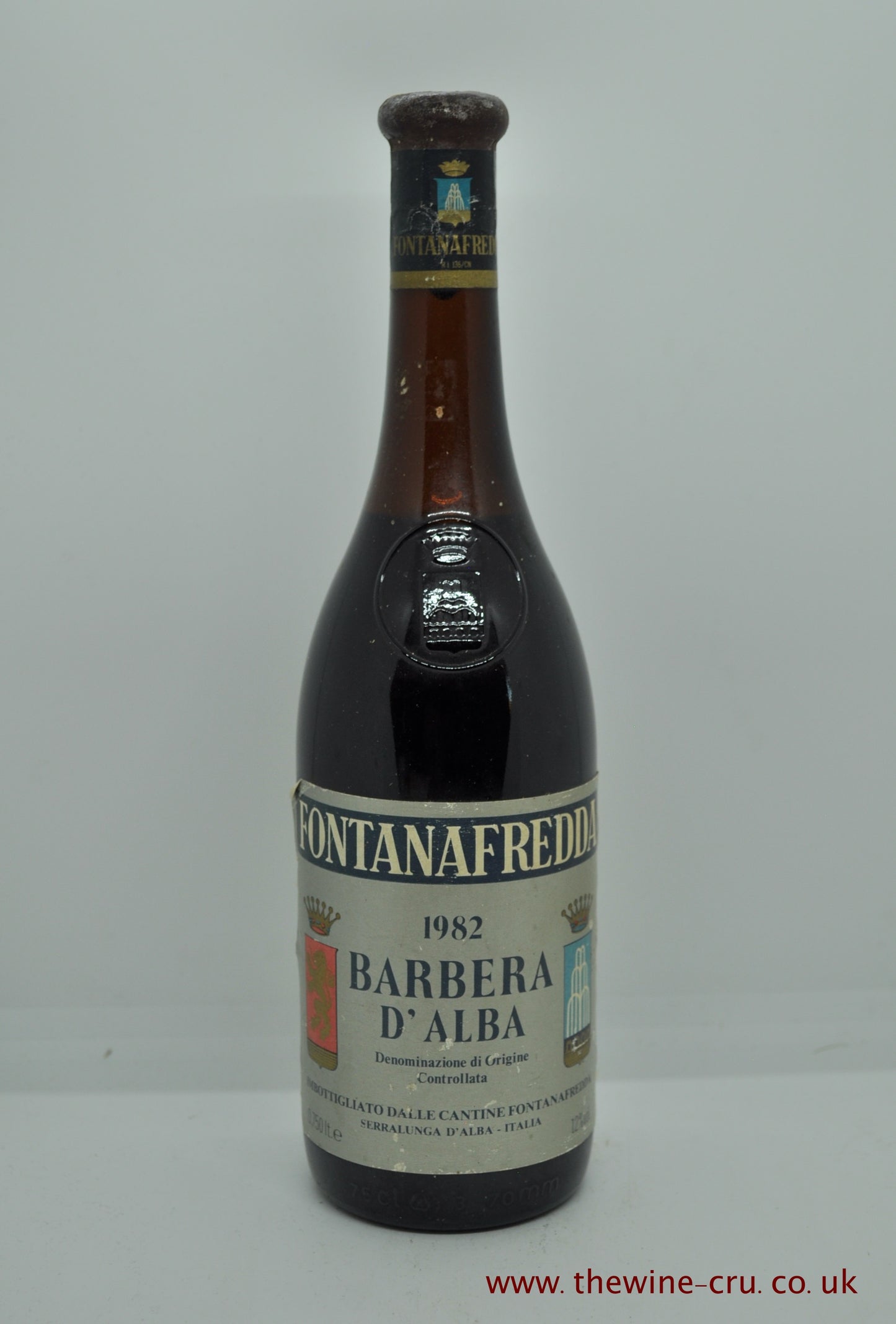 A single bottle of 1982 vintage red wine from Italy. Fontanafredda Barbera D'Alba 1982. The bottle is in good condition generally with the level of the wine being just above the emblem. About 5cm below the base of the cork. Immediate delivery. Free local delivery. Gift wrapping available.