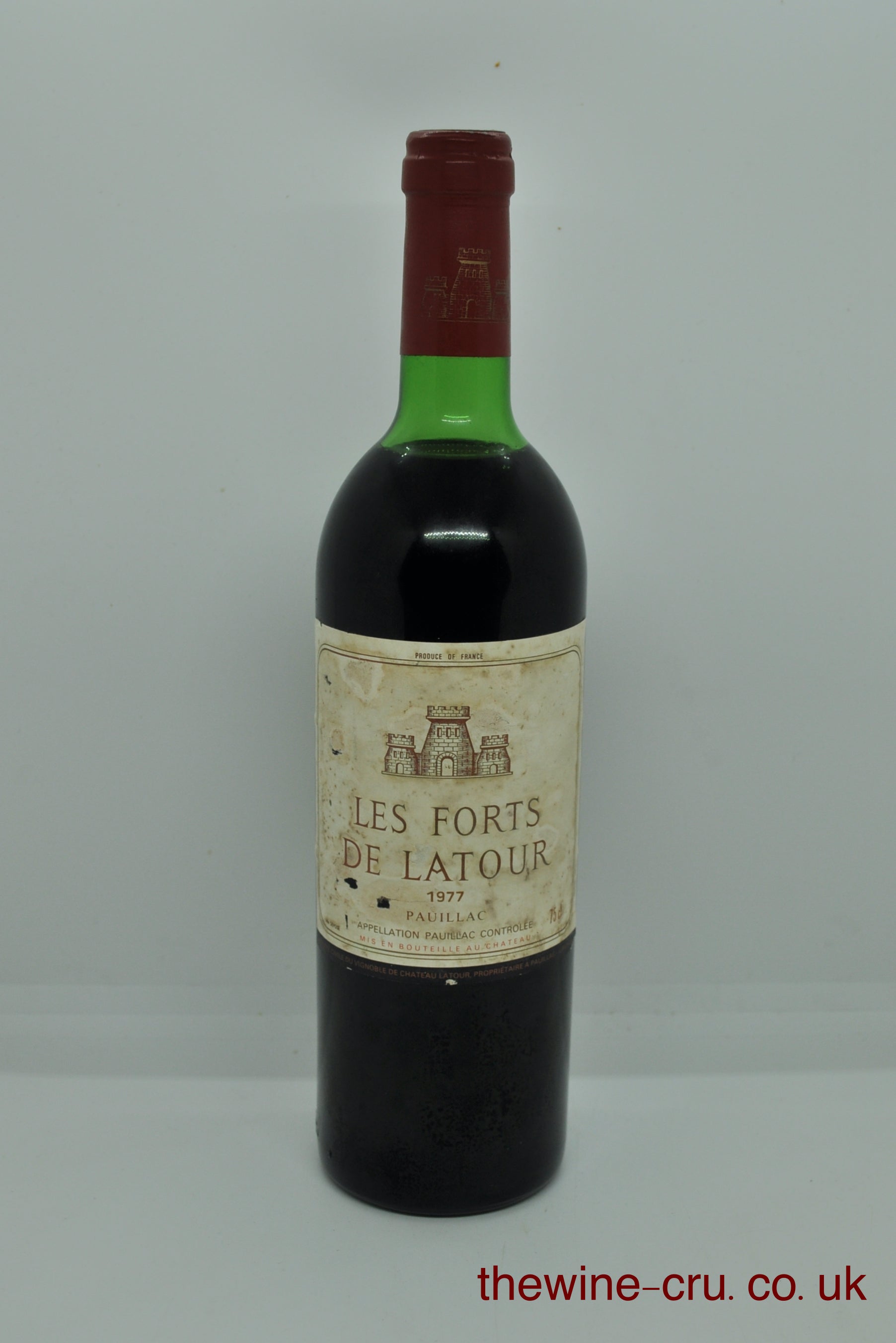 1977 vintage red wine for Pauillac, Bordeaux. The bottle is in good general condition. The label is a little bin soiled and the wine level is top shoulder. Immediate delivery. Free local delivery. Gift rapping available
