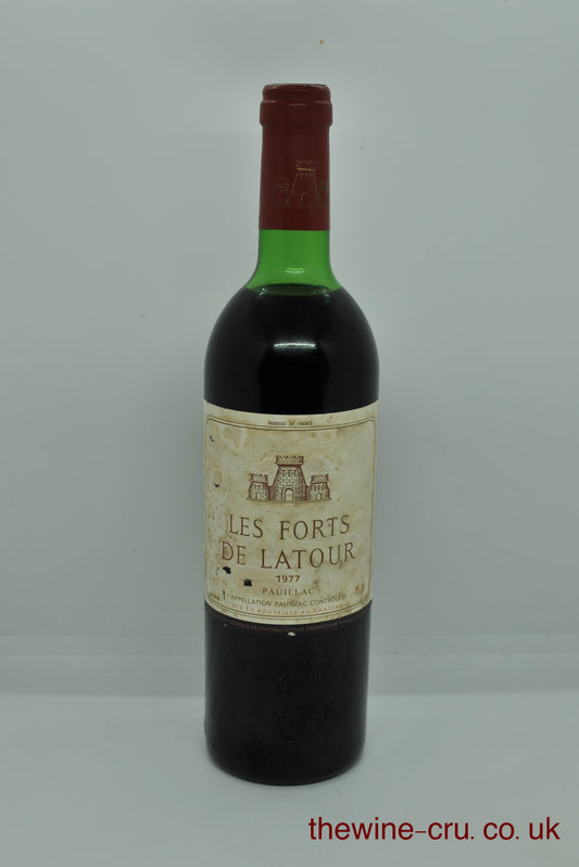 1977 vintage red wine for Pauillac, Bordeaux. The bottle is in good general condition. The label is a little bin soiled and the wine level is top shoulder. Immediate delivery. Free local delivery. Gift rapping available