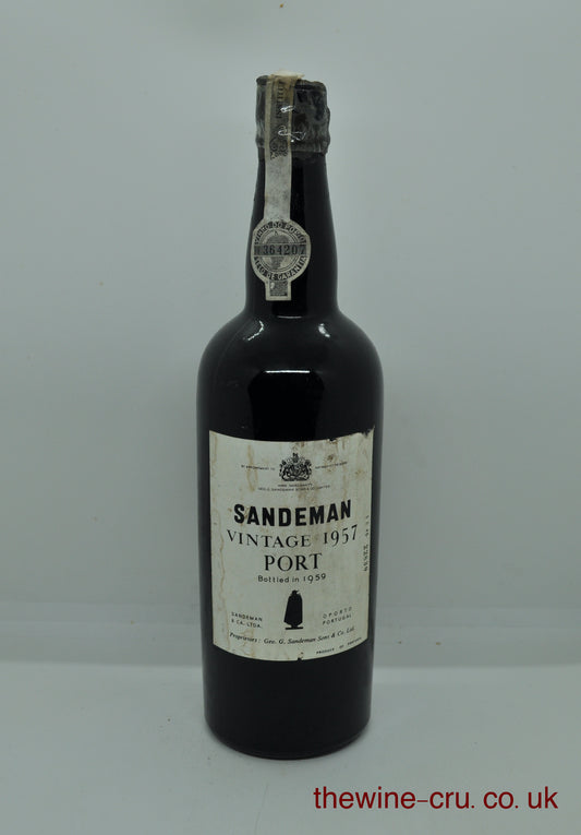 1957 vintage red port wine. The bottle is in good general condition. The wax capsule is chipped and fragile. The wine level is top shoulder. Immediate delivery. Free local delivery. Gift wrapping available.
